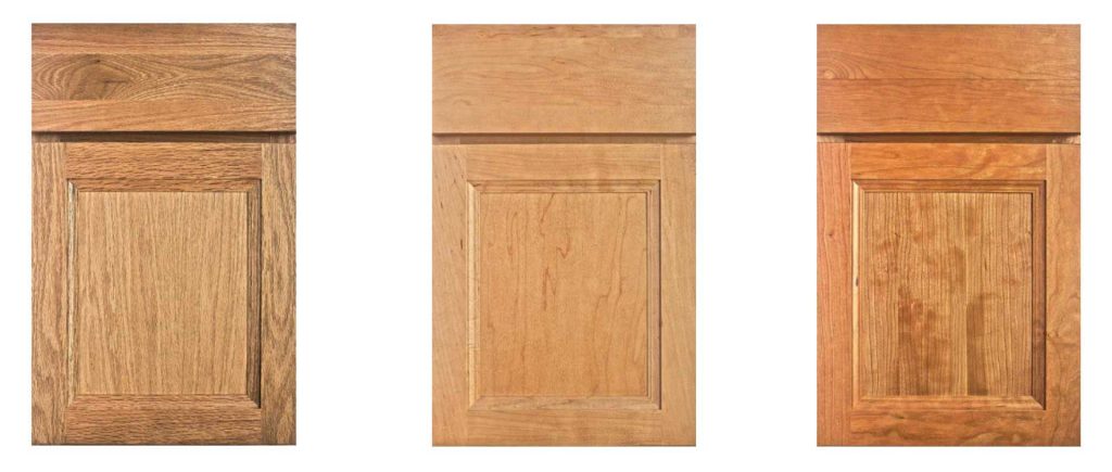 Three wooden cabinet doors are displayed side by side on a white background, each with a rectangular panel and subtle variations in wood grain and color, ranging from light to medium brown.